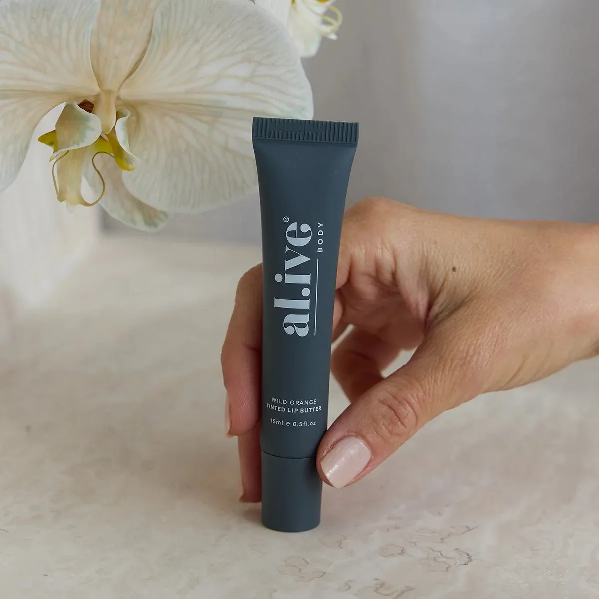 al.ive body Tinted Lip Butter - Wild Orange